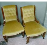 A pair of late Victorian mahogany framed and button back upholstered chairs on turned legs with