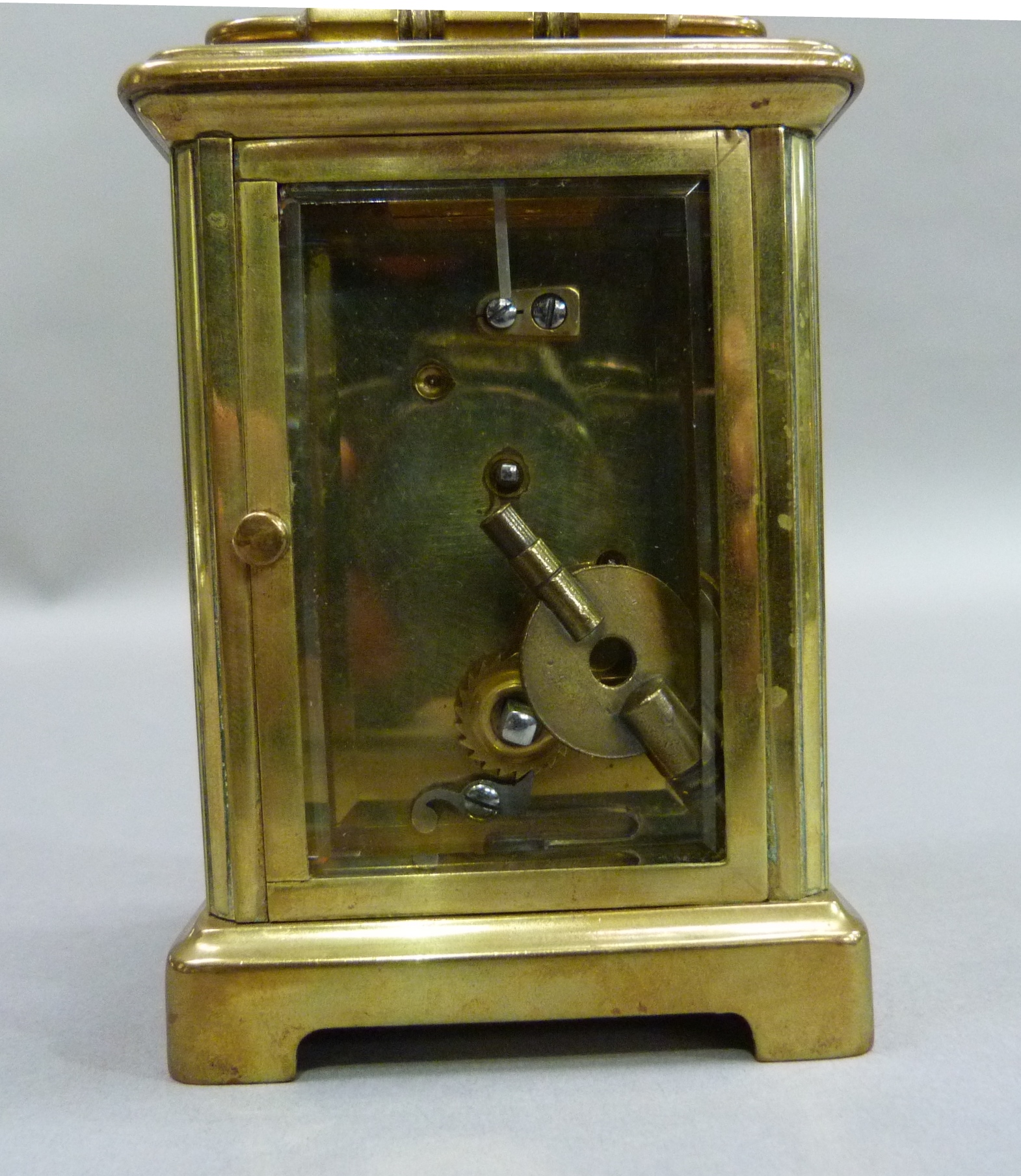 A brass carriage clock with key, white enamelled dial with black Roman numerals, 15cm overhandles - Image 4 of 4