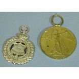 A WWI war service medal in 9ct gold for William Pit Southmoor awarded to Sapper W.E Ridley