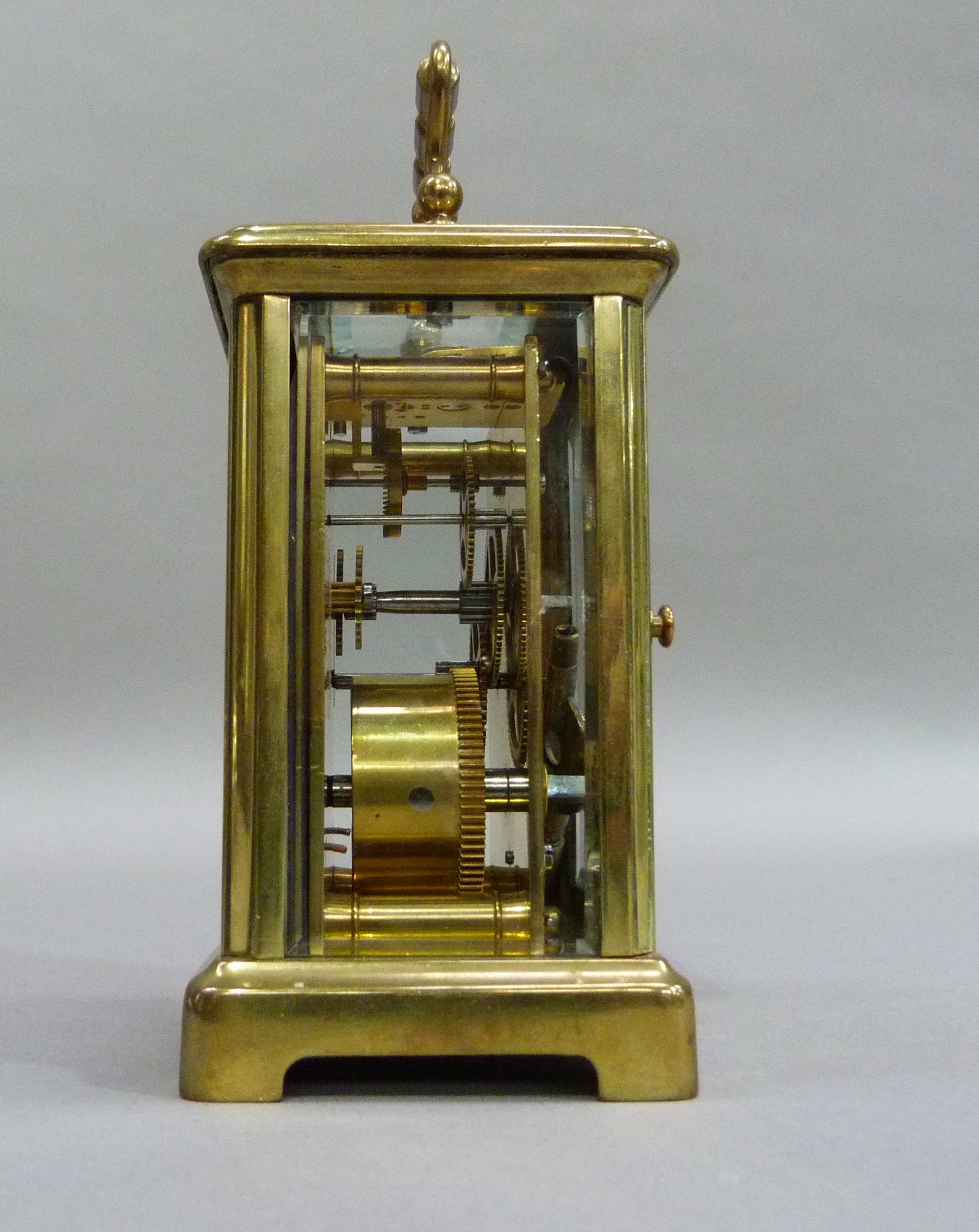 A brass carriage clock with key, white enamelled dial with black Roman numerals, 15cm overhandles - Image 3 of 4