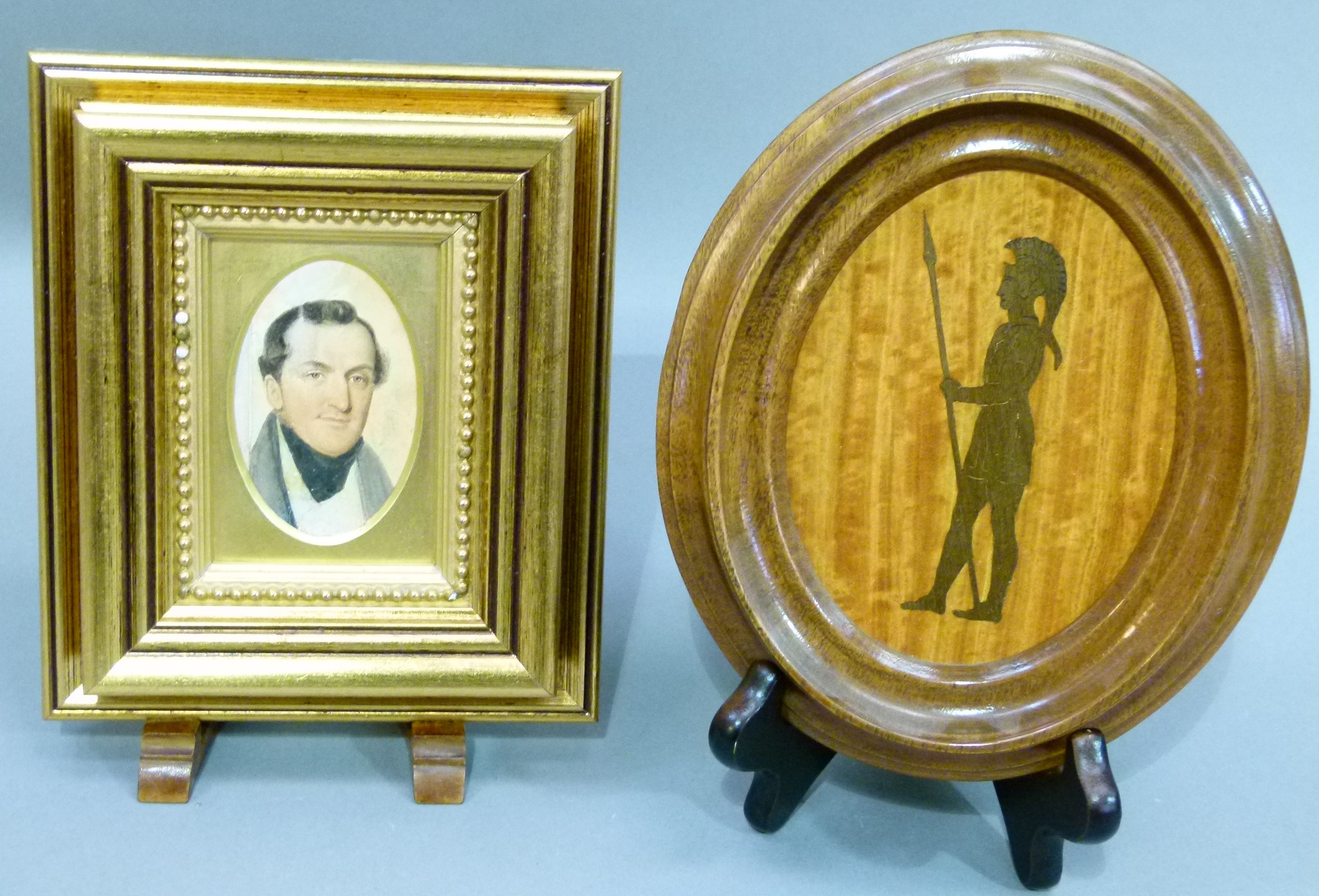 A 19th century oval miniature watercolour of a gentleman, 8cm x 5cm and an oval plaque decorated
