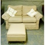 A two seater upholstered sofa together with an upholstered box stool with hinged lid on turned
