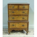 A reproduction walnut chest of two short and three long graduated drawers, 64cm wide x 100cm high