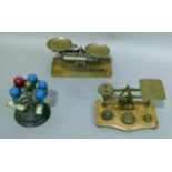 Two sets of postal scales and a desk stamp holder cast iron and brass, 35cm