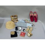 A length of fabric, pair of Turkish type slippers, straw hat, suede plaited belt, manicure sets,