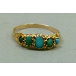 A Victorian five stone turquoise ring in 18ct gold the graduated oval cabochon stones collet set