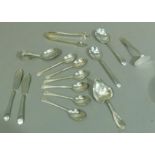 A small collection of silver cutlery including spoon and pusher, six silver coffee spoons, sugar