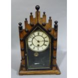 An American mantel clock in an ebonised architectural case, 45cm high