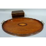 An Edwardian mahogany and inlaid oval tea tray with brass handles 55cm wide and a satinwood inlaid
