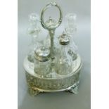 A Victorian silver plated five bottle cruet with pierced decoration and splay feet, 26cm high