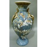 An early 20th century Japanese vase mounted with dragons to the shoulders and enamelled with blossom