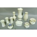 A small quantity of Belleek porcelain including, vases, box and cover, set of three spiral fluted