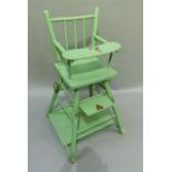 A green painted child's folding high chair by Tri-Ang with transfer printed decoration, 60cm high