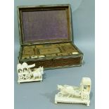 An Anglo Indian sandalwood workbox with carved decoration and ivory inlay, part fitted interior 31.