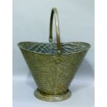 A pressed brass coloured metal coal hod with swing handle