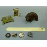 A Bavarian carved bear, WWI vesta, four WWI and later badges, brass box and a page turner