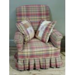 An Edwardian mahogany armchair later upholstered in a plaid fabric on short tapered legs and ceramic