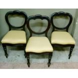 Three stained mahogany balloon back dining chairs