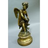 A reproduction gilt metal figure of cupid with quiver of arrows on a socle, 34.5cm high