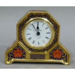 A Royal Crown Derby porcelain mantel clock pattern 1128, cypher LV, 11cm high