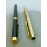 Shaeffer ball point pen in gold plated and black case together with Ferre gilt metal cased ball