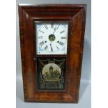 A New Haven Clock Co 30 hour wall clock in a rectangular mahogany case with painted dial, 66cm high
