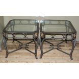 A pair of glass inset and bronzed metal lamp or side tables of square outline with canted corners