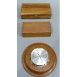 An oak cased aneroid barometer, 20cm diameter, an inlaid card case and another box