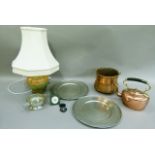 A pair of pewter chargers, 32cm diameter, a pewter quaich, a copper pot, a table lamp and a copper