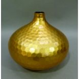 A gilded pottery vase of compressed circular outline and moulded honeycomb design, 23cm high