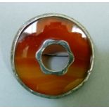 A Scottish silver plaid brooch set to the centre with pierced centre within a circular outline,
