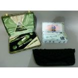 A vintage black beadwork evening purse, together with an Art Deco manicure set in case and blue