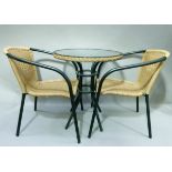 Glass topped garden table on black tubular metal legs and underframe with woven frieze together with