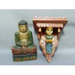 An Indian polychrome decorated shelf, together with a polychrome decorated wooden Buddha, shelf 48cm