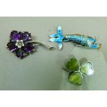 A mid 20th century amethyst and silver pansy brooch, claw set with five pear shaped facetted