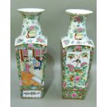A pair of 20th century Chinese famille rose vases of tapered square section, painted with panels