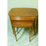 A nest of three mahogany veneered occasional tables, 60cm wide and smaller
