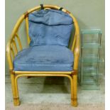 A bamboo elbow chair with arcaded back, stuffed over seat, on triple fore legs