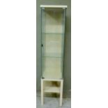 A display cabinet glazed with two shelves on a wooden base, 40cm wide maximum x 172cm high