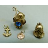 A small collection of 9ct gold charms including a paste set lantern (a/f), total approximate