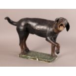 AN UNUSUAL 18TH CENTURY PAINTED CARVED WOODEN MODEL OF A DOG, standing on three legs, his right fore
