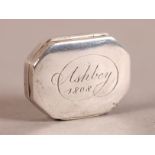 A GEORGE III SILVER PILL BOX, Birmingham 1906, maker's mark CM, rectangular with cut corners, the