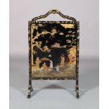 A BLACK LACQUERED AND GILT CHINOISERIE FIRESCREEN, with arched carrying handle, the indented panel