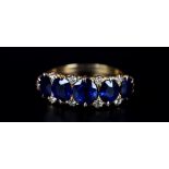 A VICTORIAN SAPPHIRE AND DIAMOND RING in 18ct gold the five oval faceted sapphire claw set inline