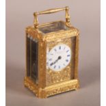 A LATE 19TH CENTURY ORMOLU CASED CARRIAGE CLOCK with ornate foliate cast and chased case, the