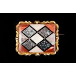 A VICTORIAN HARDSTONE PLAQUE BROOCH in 18ct gold, the contrasting matrix of inlaid lozenges within a