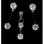 A PAIR OF DIAMOND PENDANT EARRINGS each set with two brilliant cut diamonds divided and pendent from