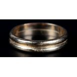 A TWIN BAND RING (approximate width 4.75mm) in yellow metal (tests as 14ct gold), finger size S,