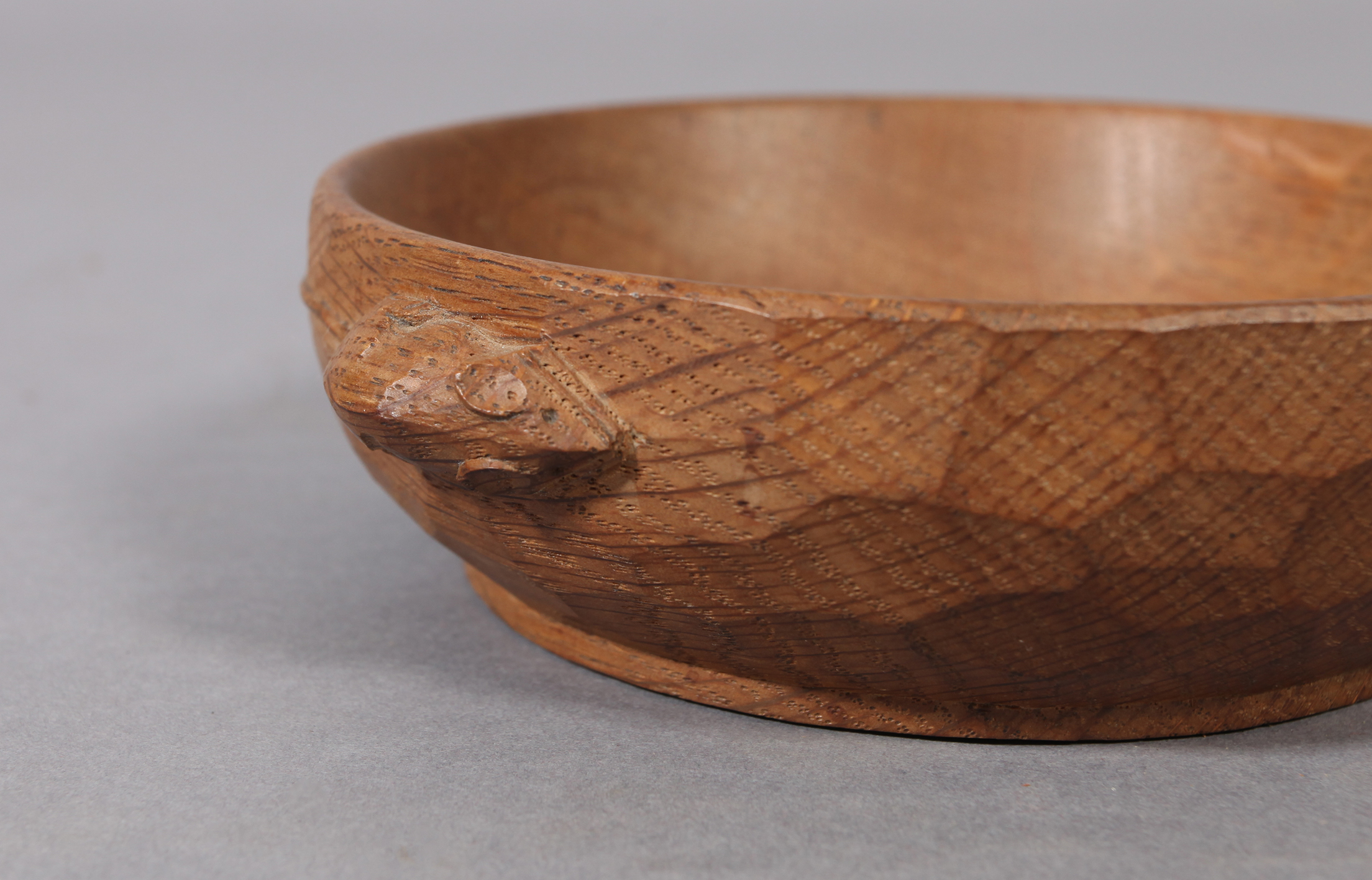 THOMPSON OF KILBURN 'MOUSEMAN', an oak small circular adzed bowl with shallow foot, carved with a - Image 2 of 2