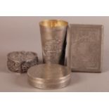 A LATE 19TH CENTURY INDIAN SILVER TAPERED CYLINDRICAL BEAKER embossed with figures on the banks of a